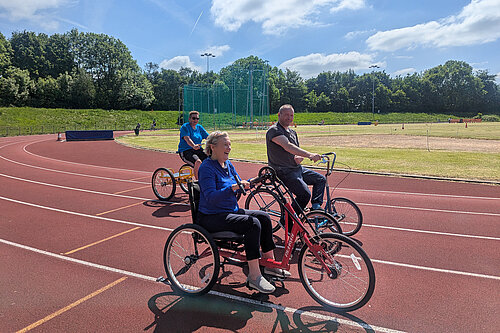 Lisa Smart MP on the track with the Wheelers at Woodbank Park