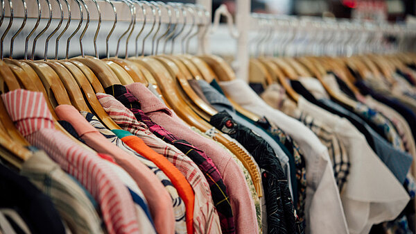 Clothes on hangers in a shop