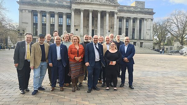 Portsmouth's Liberal Democrat councillors stood in front of Portsmouth Guildhall