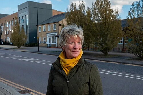 Pippa Heylings beside a road on one of the new housing developments in South Cambs