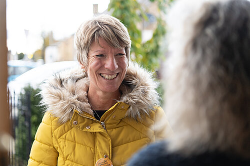 Pippa Heylings listening to a South Cambs resident on their doorstep