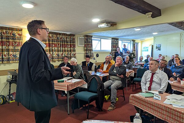 Olly speaks at flood summit