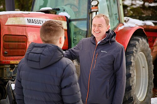 Tim listening to a local farmer