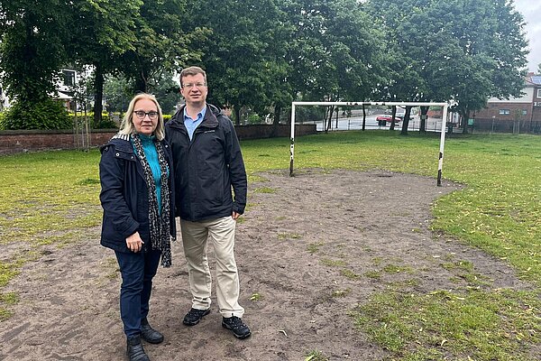 Will Frass and Jane Brophy stood old the worn patch of grass 