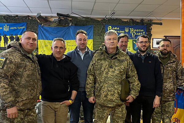 Alex Cole-Hamilton meeting the Ukrainian military after delivering ambulances