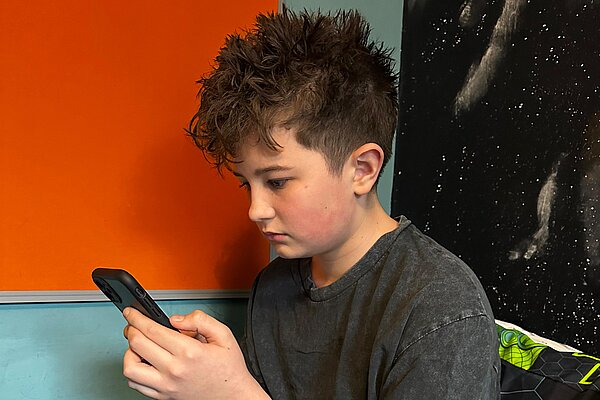 Child looking at social media