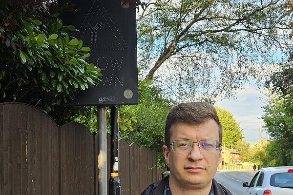 Cllr Frass with the broken electronic speed warning sign