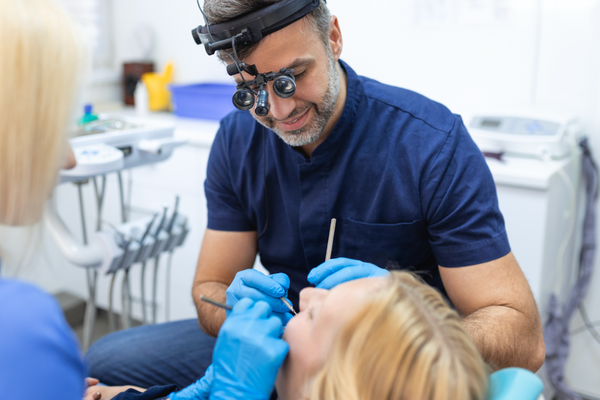 Dentist performing a check up on a patient