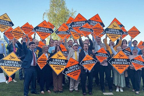 42 Lib Dem winners celebrating their victory