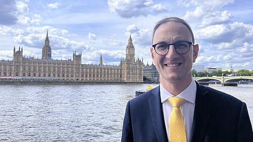 Ian Sollom across the river from the Palace of Westminster