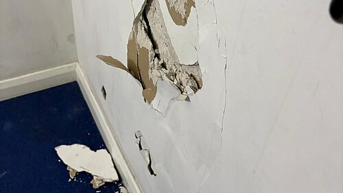 Damage to the walls in Manston Court