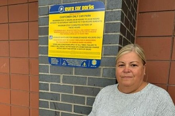 Kathryn Rooney with parking restrictions signage