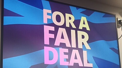 For a Fair Deal slogan with Union Flag on screen