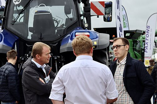 Tom Gordon and Tim Farron in front of a tractor at the Great Yorkshire Show