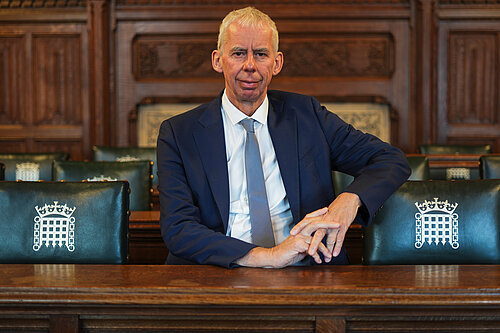 John sitting in Parliament 