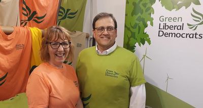 GLD Stall - Linda Johnson + Jason Billins modelling the new T-shirt