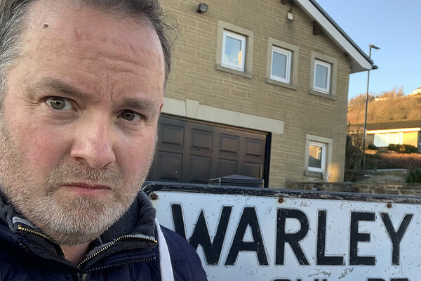 Cllr Chris Wadsworth holding FOCUS leaflets