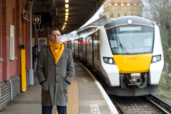 Rob Blackie pictured on a platform as an incoming train approaches