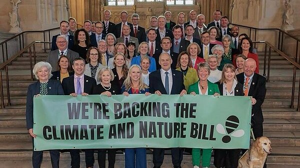 Lib Dem MPs holding the "We're Backing the Climate and Nature Bill" Banner 