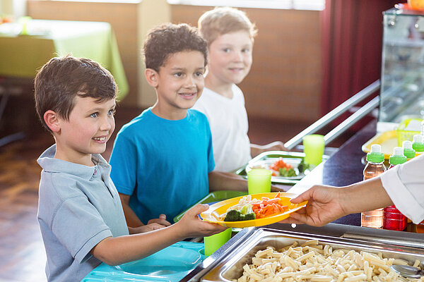 Children being served school meals