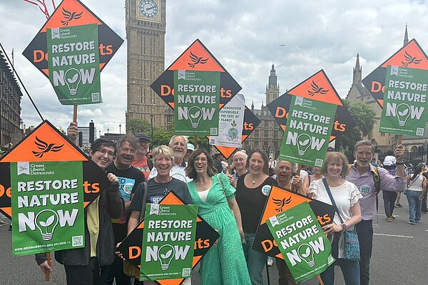 Green Lib Dems outside Parliament at the Restore Nature Now March