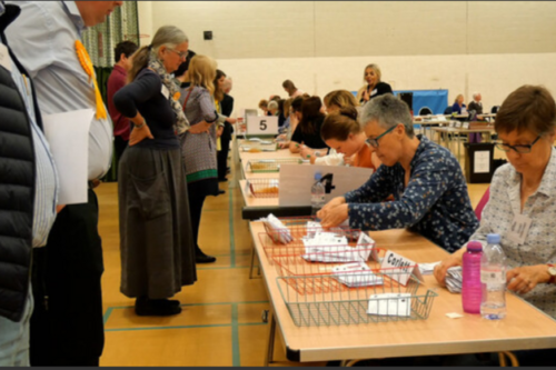 Party activists observing an election count