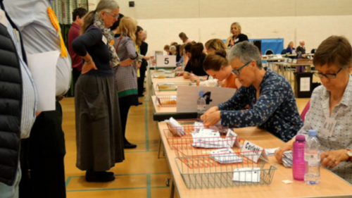 Party activists observing an election count