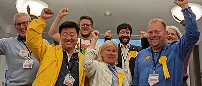 A group of Kingston Lib Dem activists with raised fists