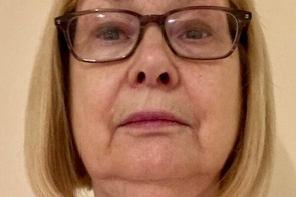 a headshot of Flora Sharp