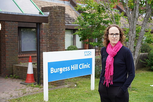 Alison next to NHS Sign