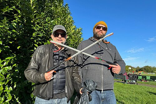 Image of councillors Jez Levy and Chris Brattle crossing litter pickers 