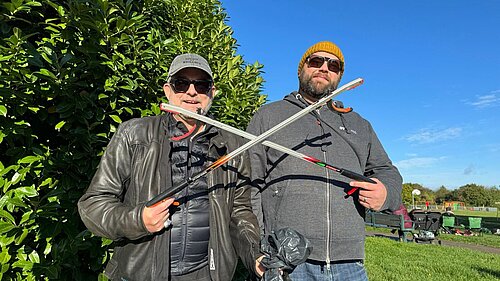 Image of councillors Jez Levy and Chris Brattle crossing litter pickers 