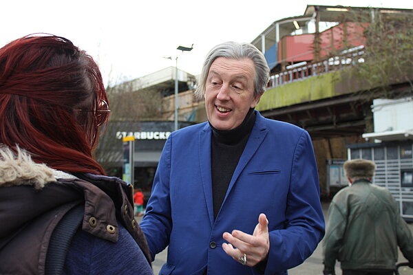 Paul Kohler speaking to resident about Wimbledon police station