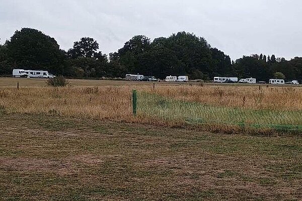 Travellers in field