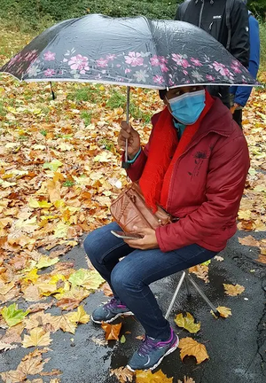 Fatima sitting in the rain