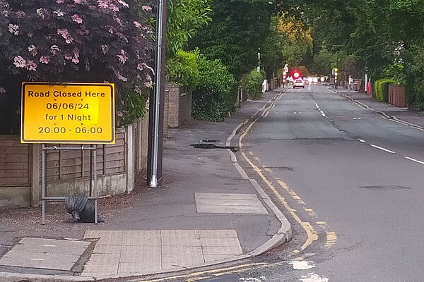 Road Closed sign, confirming the date of resrfacing to be June 6th