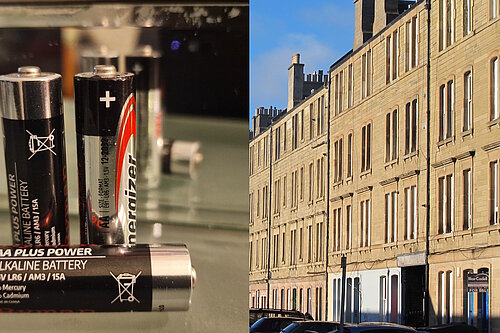 On the left are 3 batteries, on the right is tenement housing in Iona Street on a sunny day