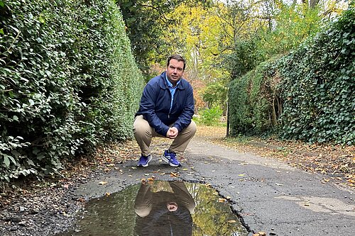 Matt Mellor on the damaged foothpath on Elers Road.