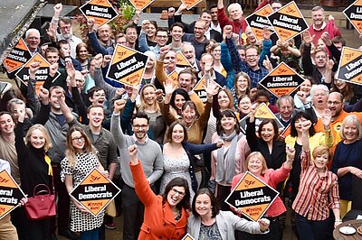 A group of Liberal Democrats celebrating victory