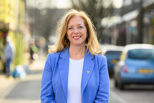 Liz Jarvis MP, standing on a highstreet