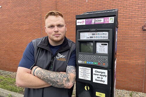 Connor happy next to Parking Meter