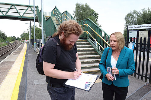 Helen gets a petition signed at Whitchurch Station in front of the long staircase