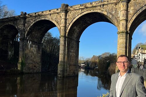 Tom Gordon stood next to the River Nidd by the Knaresborough viaduct