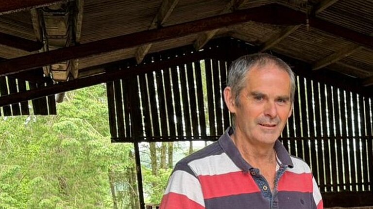 Colin with cows close (happy)