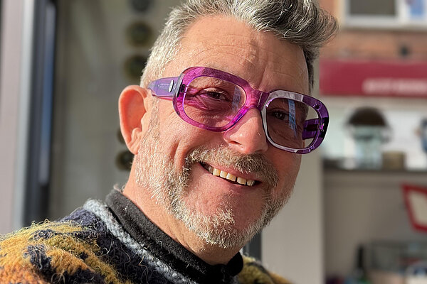 Jez Levy is smiling and looking at the camera.