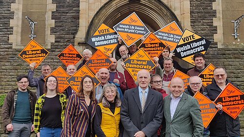 A group of Lib Dems including Sam Bennett and Jane Dodds MS welcoming the new councillors in the Uplands