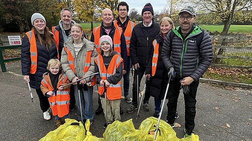 group of people in hi vis and litter pickers 