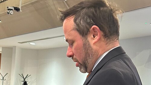 Cllr Gary Malcolm speaking at a Council meeting.