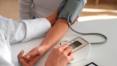 Medic taking a patient's blood pressure