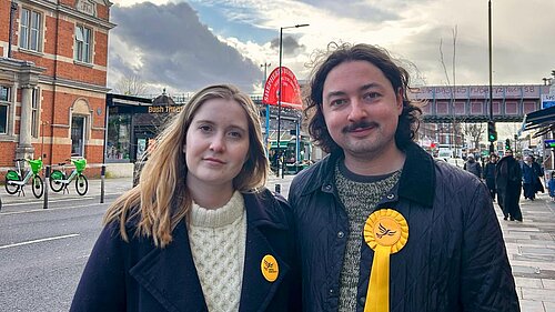 Fergus and Elsie standing in front of Shephards Bush Market Station